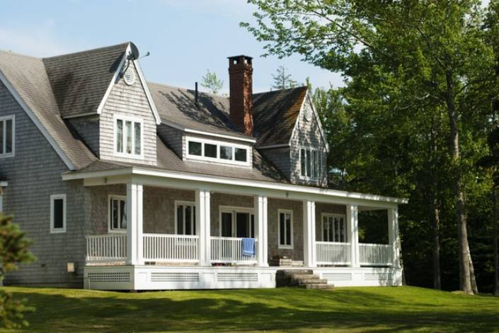 exterior of house with porch and chimney